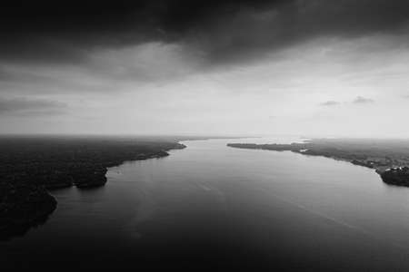 Dramatic black and white photo of the Amazon from a birds eye view.
