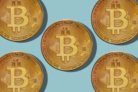 Bitcoin on a blue background. Currency of the future.