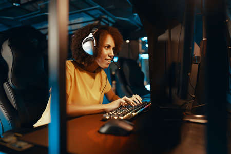 A young woman plays a computer game.