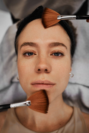 Face massage with brushes.の写真素材