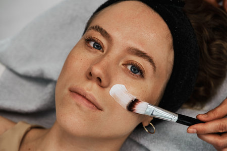 Face massage with brushes.の写真素材