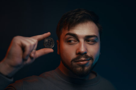 Man holding bitcoin. Financial ecosystem. The currency of the future.