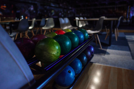 The photo showcases a collection of bowling balls, impressing with their variety, colors, and designs.の写真素材