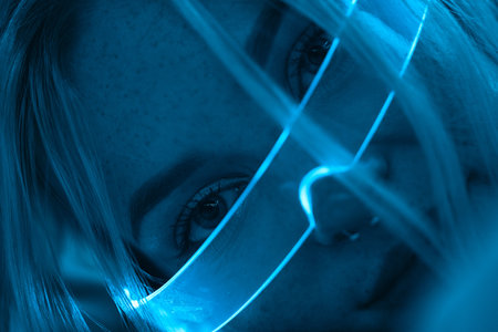 Young woman in neon glasses in futuristic style.の写真素材