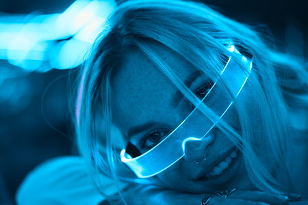 Young woman in neon glasses. Cyberpunk style.の写真素材