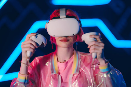 Young female gamer in pink playing vr game.