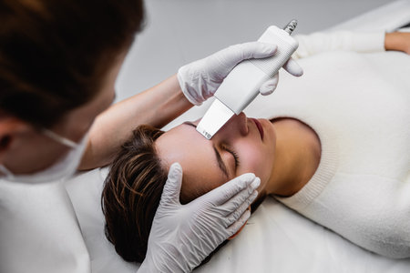 Ultrasonic cleaning of the face. Skin peeling.