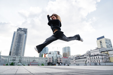 A young woman in a jump during a dance.