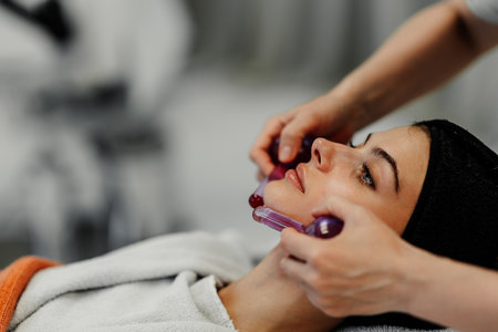The master gives the client a relaxing facial massage using cold cryo spheres.