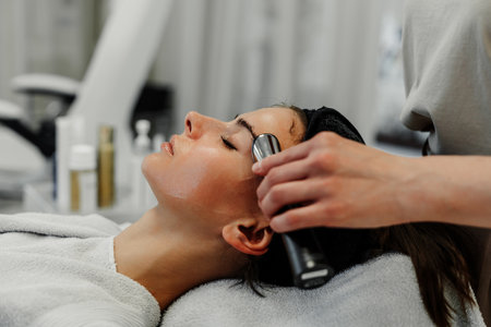 Relaxing facial massage. Health care.の写真素材