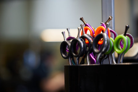 Colorful scissors in a hair salon, ready for a stylish haircut sessionの写真素材