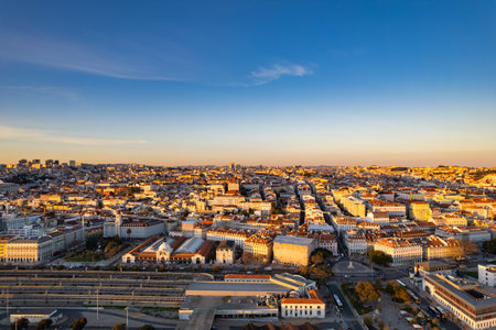 Panoramic view of Lisbon at sunset showcasing urban architecture and skylineの写真素材