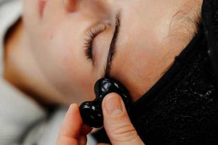 Relaxing facial massage in a serene spa environment for rejuvenationの写真素材