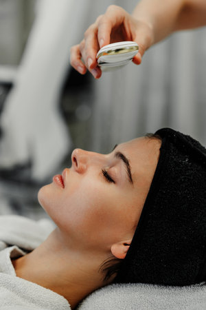 Relaxing facial treatment at a spa with a soothing massageの写真素材