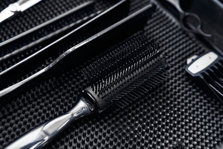 Professional hair styling tools organized on a work surface in a salonの写真素材