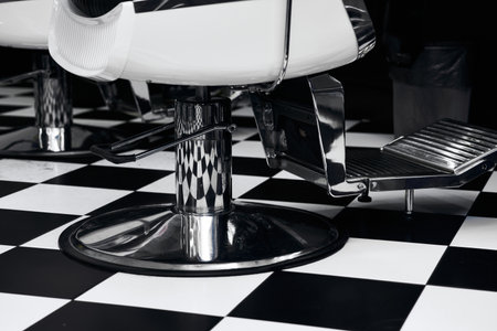 Classic barbershop interior showcasing stylish chairs and checkered floor design