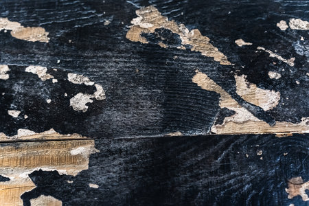 Worn textured wood surface with colorful artistic patternsの写真素材