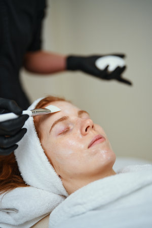 Relaxing facial treatment in a tranquil spa settingの写真素材