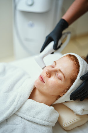 Beauty treatment session for woman in spa with gentle skin therapyの写真素材