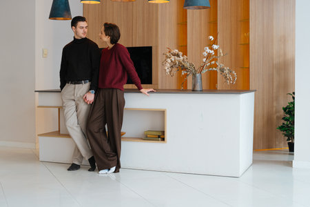 Cozy couple enjoying intimate moment in modern living spaceの写真素材