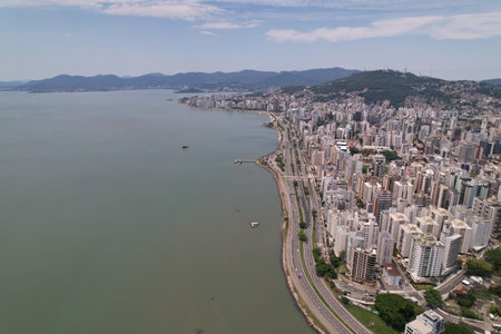 Coastal cityscape with modern buildings and serene water view