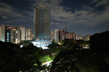 City skyline at night showcasing urban buildings and street lights