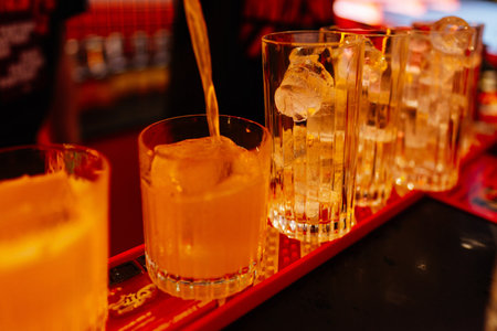 Crafting colorful cocktails at a bustling bar during the nightlife hours