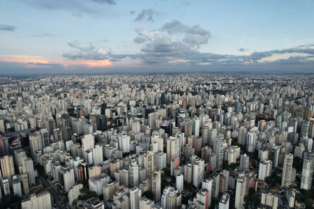 Urban landscape in Sao Paulo showcasing extensive city skyline during sunsetの写真素材