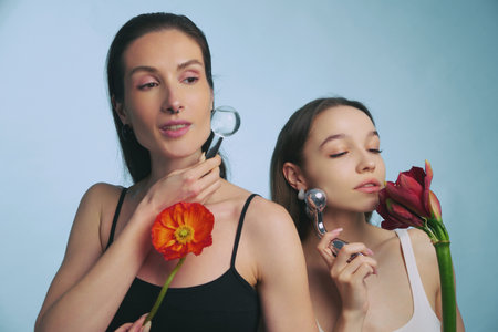 Beauty and wellness ritual with flowers and reflective tools indoorsの写真素材