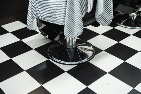 Elegant barbershop interior with classic black and white checkered floorの写真素材