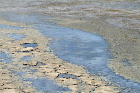 Bay when the tide is out, showing interesting colors and texturesの写真素材