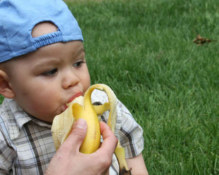  taking a bite out of a bananaの写真素材