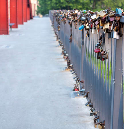 Colorful padlocks on the Bishop's Jordan bridge between Srodka and Ostrow Tumski in Poznanのeditorial素材