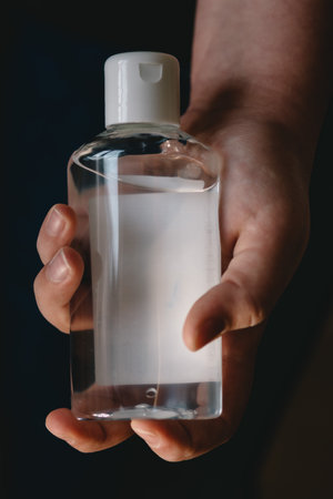 Girl applying disinfect hand sanitizer gel. For the prevention of coronavirus disease (Covid-19).