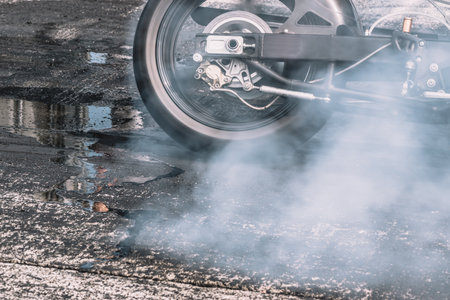 motorcycle on the speedway, drag motorcycle, burning rubber, speed, powerの写真素材