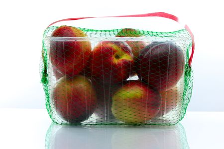peaches packed in a plastic containerの写真素材