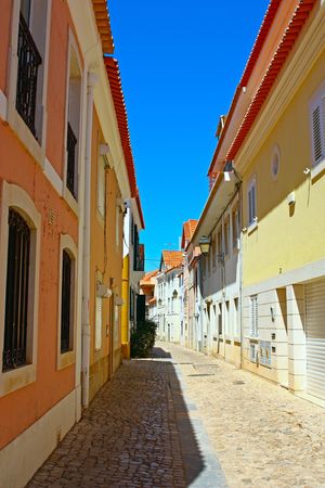 A narrow street in Lisbon, Portugalの写真素材