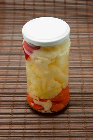 Glas jars with marinated vegetables  isolated on the white backgroundの写真素材