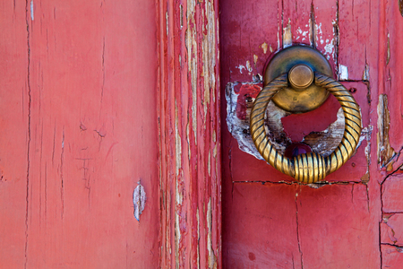 Brass  knocker on old wooden door in Lisbonの写真素材