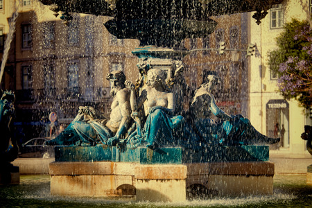 Sculptures at  fountain in Rossio Square, Lisbon, Portugalの写真素材