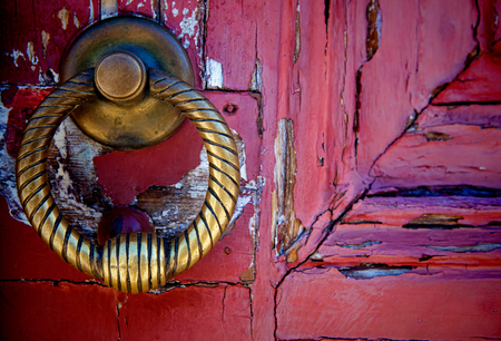 Brass  knocker on old wooden door in Lisbonの写真素材