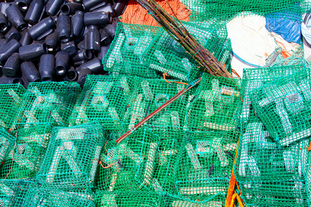 Lobster pots and crab pots drying in the sun on the pier, Cascais, Portugal
