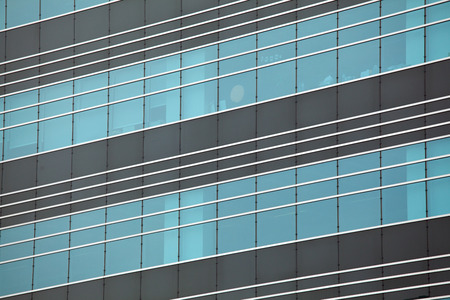 Modern glass silhouettes on modern building