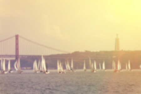Yachts a sailing regatta at the sea during sunset . Blurred image of a yachts の写真素材