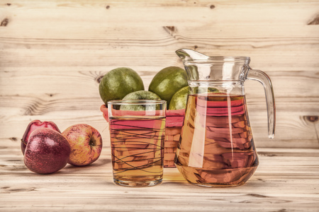apples and apple juice on a wooden backgroundの写真素材