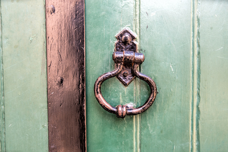 old wooden entrance door with antique door handle