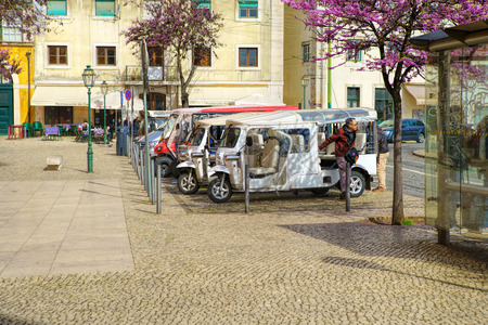 LISBON - MARCH 29 , 2018 : motorized taxi on the street in Lisbon, Portugal