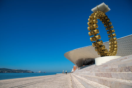 Lisbon, Portugal - July 23, 2024: View along the steps and river facing front of futuristic Museum of Art, Architecture and Technology (MAAT) designed by Amanda Levete Architectsのeditorial素材