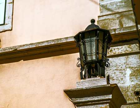 One old black iron lantern with white glassの写真素材
