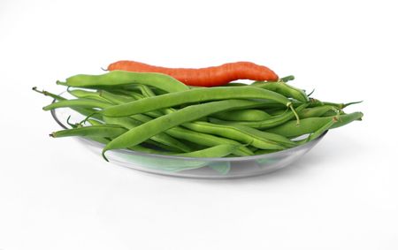 Glass dish with green beans on a white backgroundの写真素材